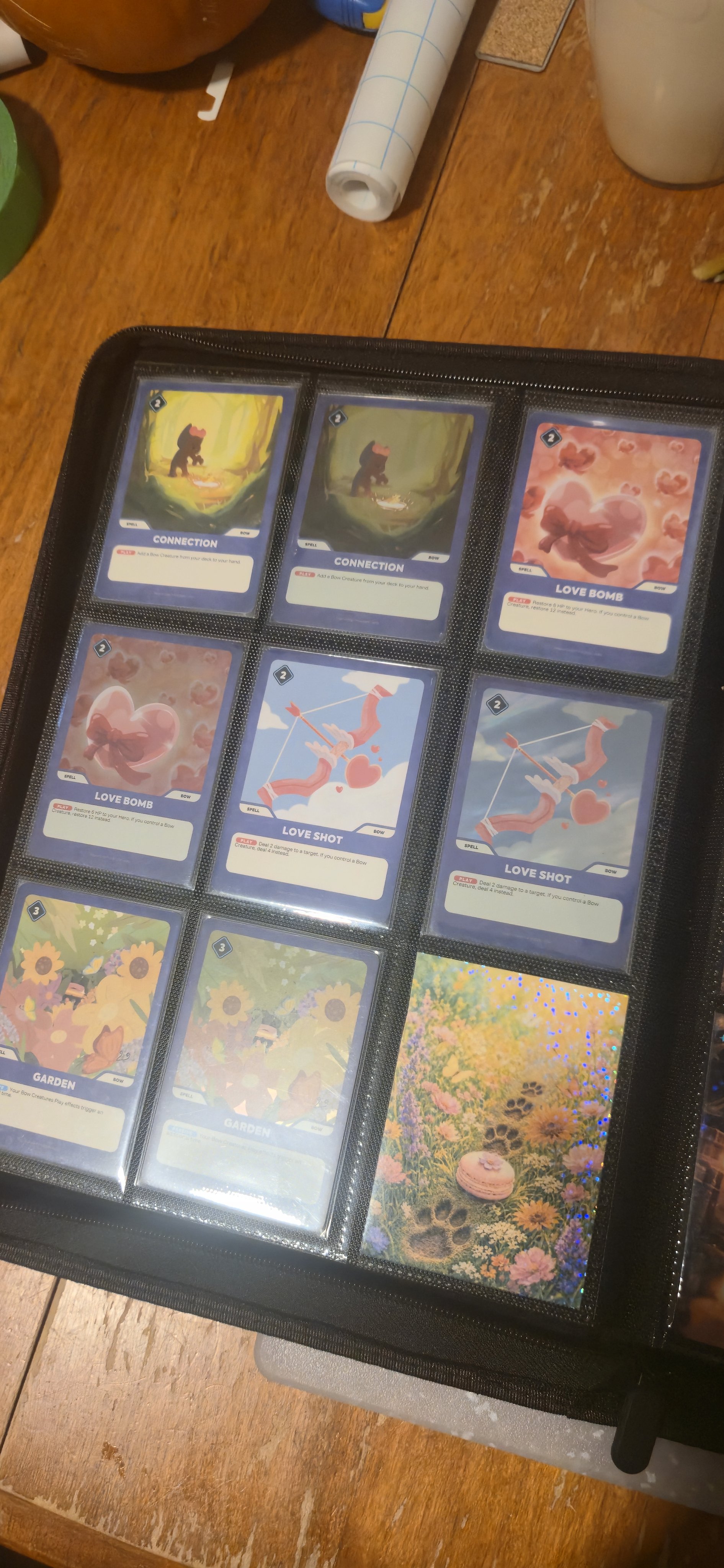 A binder page of Doginal Dogs Legends cards, including Connection, Love Bomb, Love Shot, and Garden