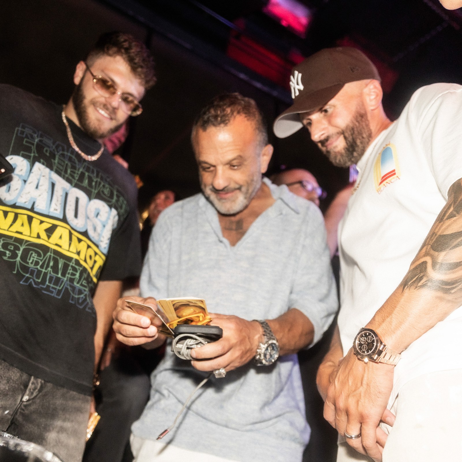 Guests look through Doginal Dogs Legends cards at DDNYC 2026 in New York